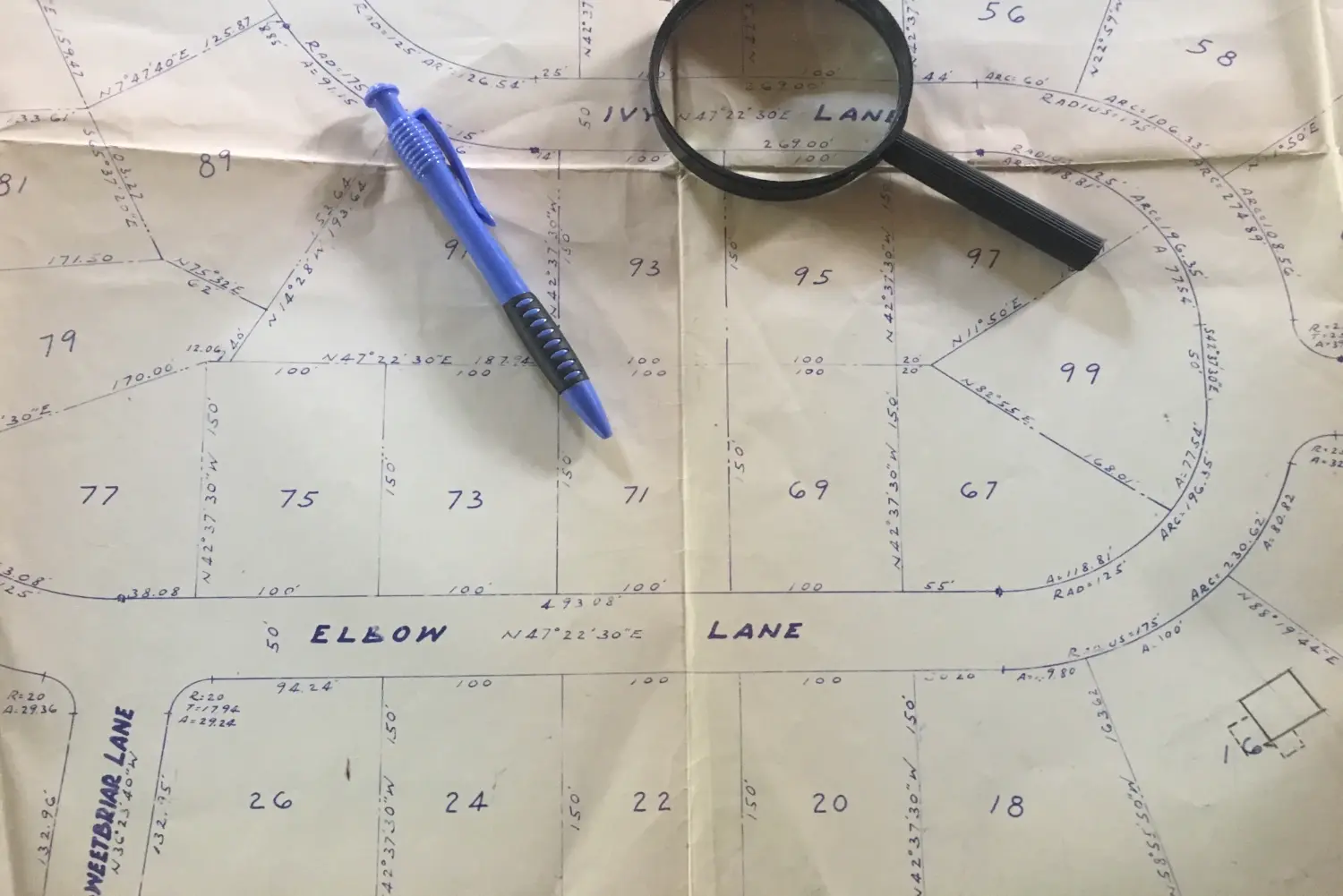 Recorded plat map with property boundary bearings and measurements reviewed for an ALTA survey