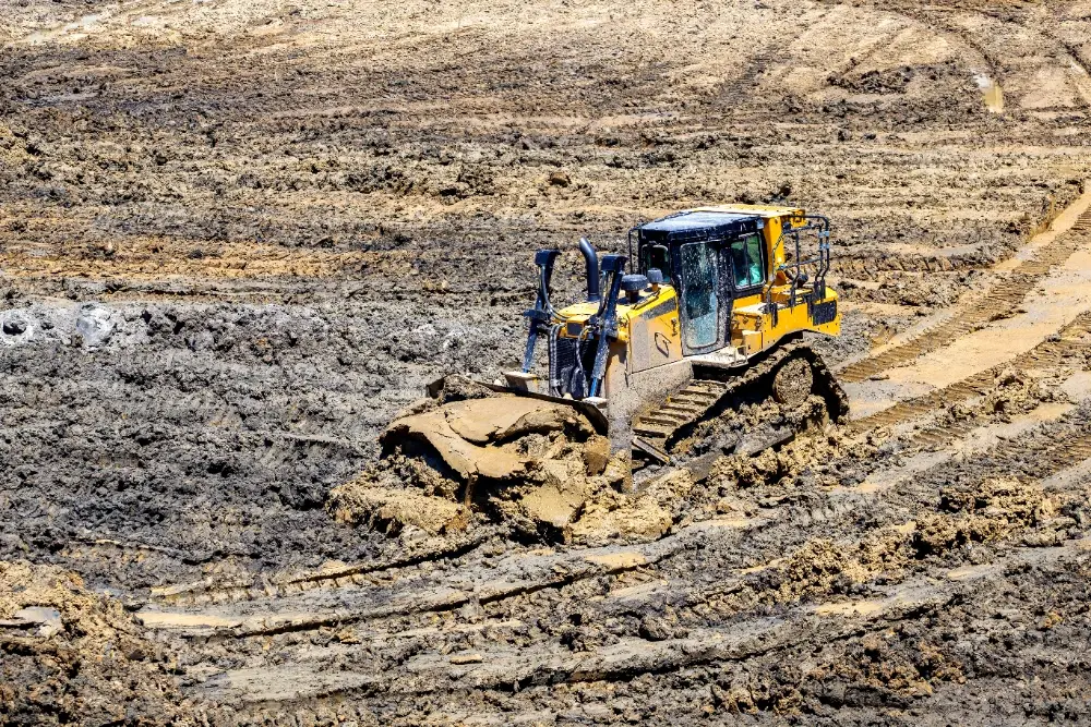 Bulldozer performing grading and earthwork at an active construction site