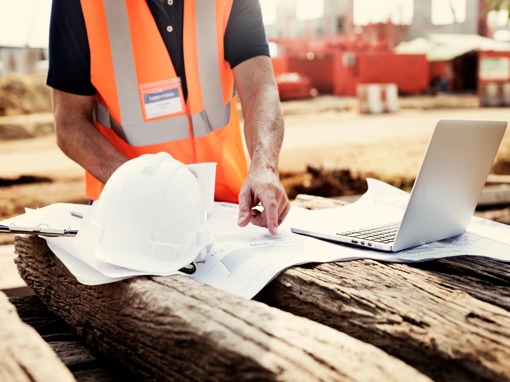 Magrym engineer reviewing project plans on site during environmental permitting in Midland, Texas