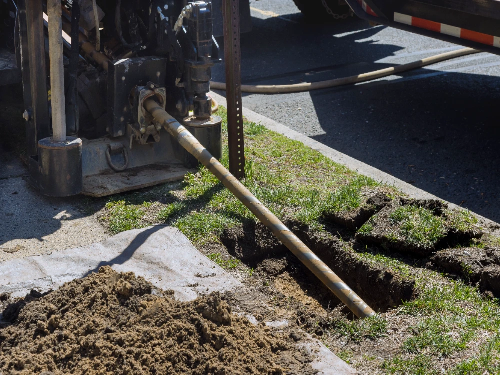 Engineer verifying bearing conditions in an open footing excavation in Midland, Texas