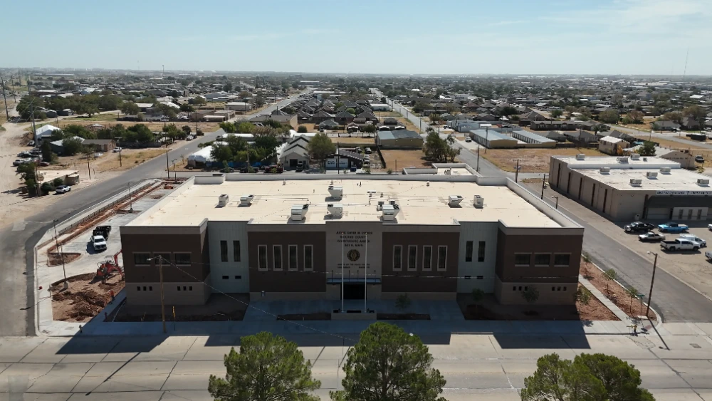 Midland County Justice of the Peace Annex: The completed annex looking north over downtown Midland, with landscaping and street frontage finished.