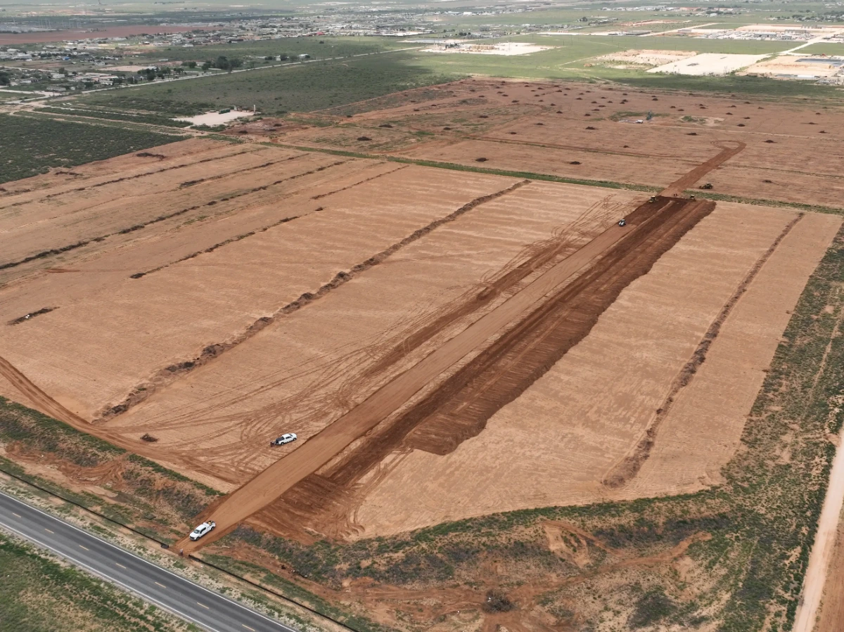 Pony Express Subdivision: The 97 acre tract before construction, with lot lines mowed in and the highway frontage along the west edge.