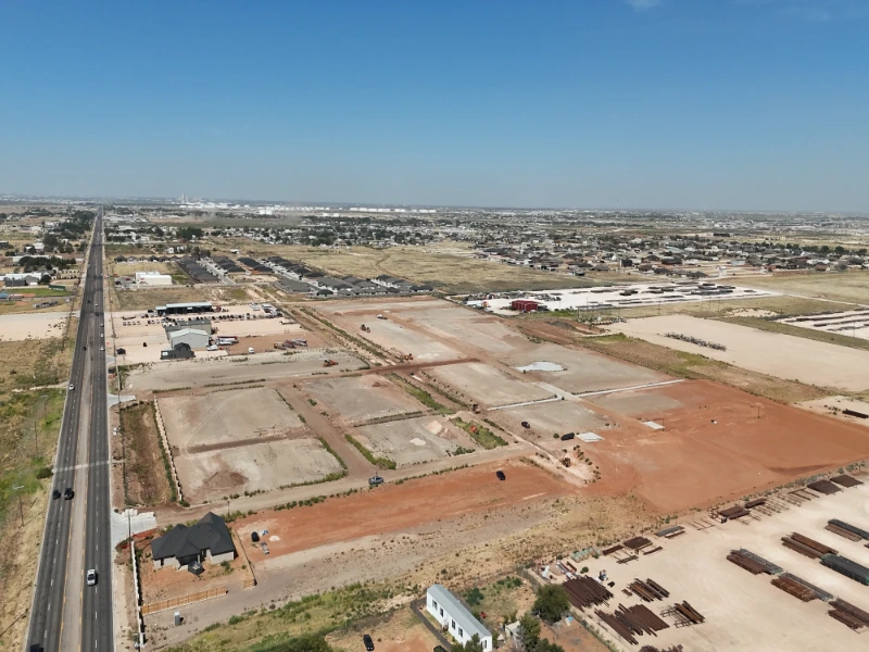 The Nest Subdivision: Street corridors graded and based along the highway frontage, ready for paving and utilities.